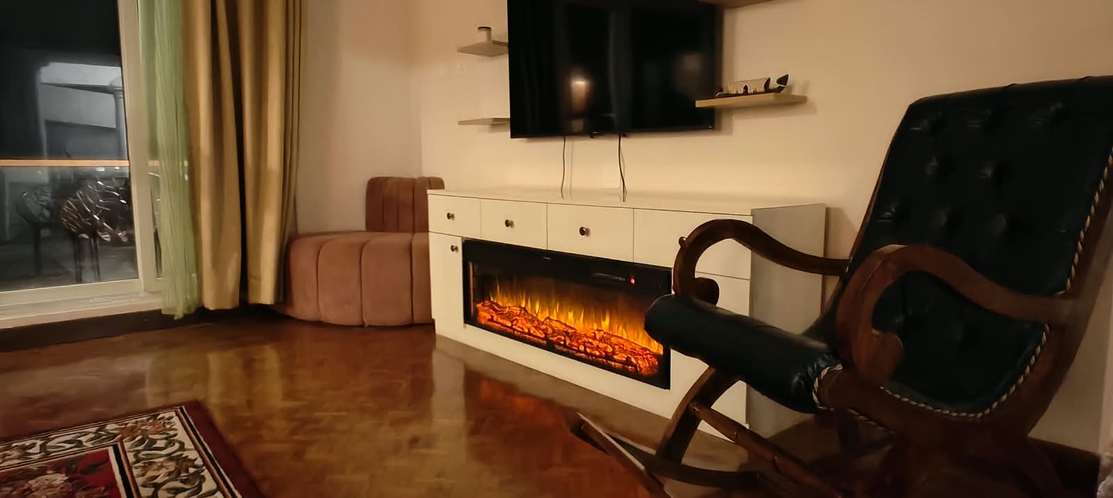 The living room fireplace, lit on a cold evening